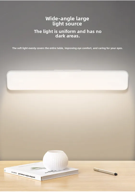 Light bar mounted under a shelf casting a wide, even glow over the work surface